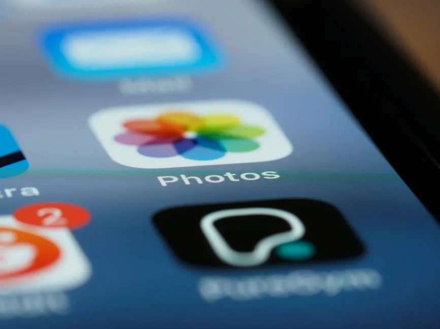 Smartphone showing communication icons for call, email, and messaging on screen.
